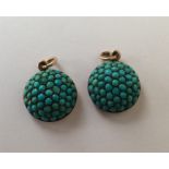 A pair of Antique turquoise pendants with gold loo