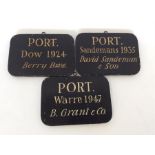 A group of three unusual wooden bin labels each de