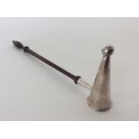An unusual Georgian style silver snuffer on turned wooden