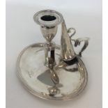 A good oval Georgian silver chamber stick with ree