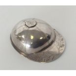 A large silver jockey cap caddy spoon with bright cut eng