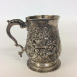 A good George III embossed silver christening cup attract