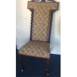 A mahogany mounted library chair with twisted stem