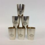 A heavy set of six silver Russian tots with modernistic e