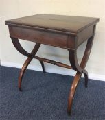 An unusual hinged top card table with turned stret