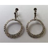 A good pair of large cocktail earrings of circular