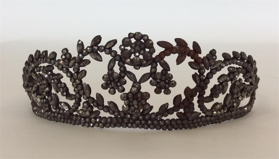 An Antique cut steel hair piece decorated with flo