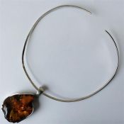 An unusual silver and amber pendant / collar. Est.