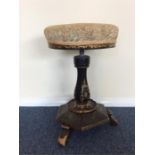 An attractive late Victorian piano stool with pain