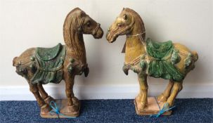 A pair of Tang style figures in the form of horses