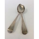 A pair of Georgian OE silver basting spoons. Londo
