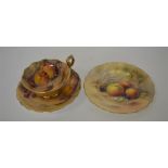 A decorative Royal Worcester trio painted with fru