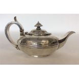 A good bright cut silver teapot decorated with scr