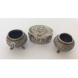 A pair of Indian silver salts together with a simi