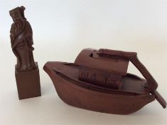 A Chinese terracotta figure of a boat together wit