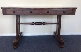 A rosewood library table with two drawers and moul
