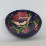 MOORCROFT: A blue ground sweet dish decorated with