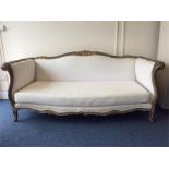 A massive French settee with gilded decoration (ce