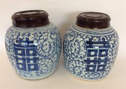 A pair of Chinese blue and white ginger jars with