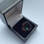 A 9 carat single stone tourmaline ring in claw mou