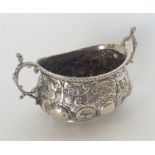 An attractive embossed silver sugar bowl with silver gilt
