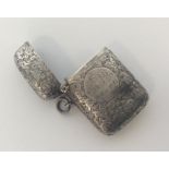 A good Edwardian silver engraved vesta case with hinged t