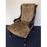 A scroll back nursing chair with fluted supports.