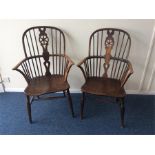 A good pair of early wheel back carver chairs on t