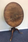 An oak pillar table on turned and ring supports. E