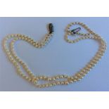 A good double string of graduated pearl beads with