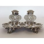 A good quality silver double inkstand in the form