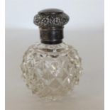 A large silver top hobnail cut scent bottled decor