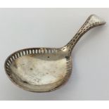 An old Sheffield plated caddy spoon with bright cu