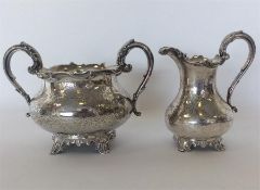 A good Victorian silver engraved cream jug and sugar bowl