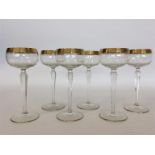 An attractive set of gilded champagne glasses on t