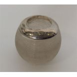 A small silver mounted match striker with textured