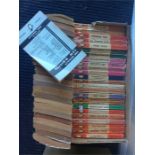 A box containing numerous Penguin books of various