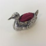 A large unusual silver pin cushion in the form of a duck