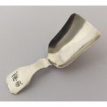 A Georgian silver caddy spoon in the form of a sho