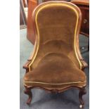 A Victorian scroll decorated armchair. Est. £50 -