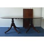 A good large mahogany dining table on sweeping sup