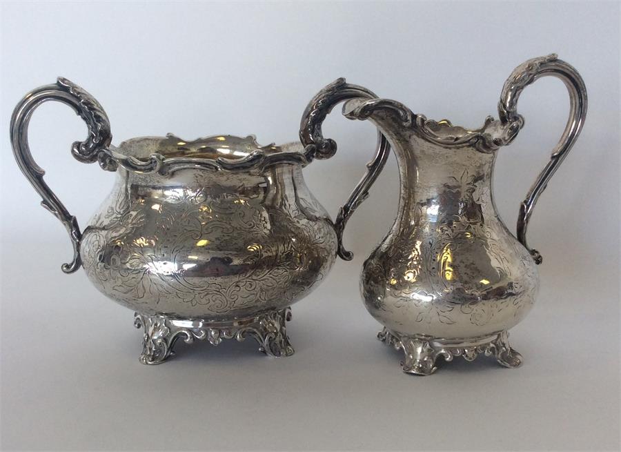 A good Victorian silver engraved cream jug and sugar bowl - Image 2 of 2