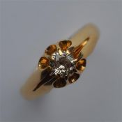 A good diamond single stone gypsy set ring in 18 c