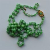 A good graduated double string of jade beads with
