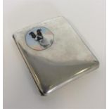 An attractively enamelled curved silver cigarette box mou