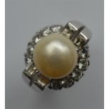 A massive pearl and diamond cocktail ring mounted