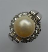 A massive pearl and diamond cocktail ring mounted