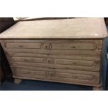 A large Continental chest of three drawers on bun