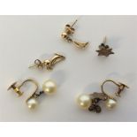 A collection of gold mounted earrings. Approx. 5.4