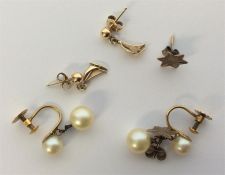 A collection of gold mounted earrings. Approx. 5.4